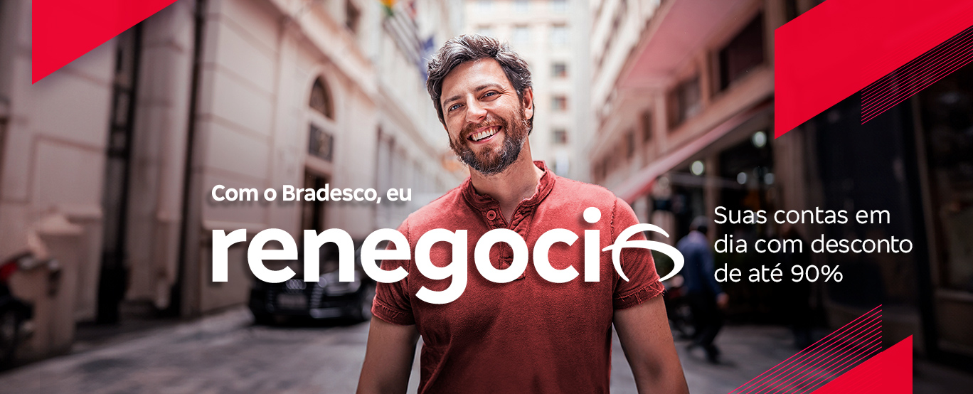 #BradescoAcessivel #PraTodoMundoVer Texto de acessibilidade: A imagem apresenta um homem branco que sorri e está com os braços abaixados. Ele tem o cabelo liso e grisalho, e veste uma camiseta vermelha. Bem em frente temos a frase “Com o Bradesco, eu renegocio”. Ao lado se encontra o texto “Suas contas em dia com desconto de até 90%”.
              Em segundo plano se nota, em desfoque, o cenário da foto: uma rua com diversos prédios. A imagem apresenta os elementos gráficos na cor vermelha em formas de linhas apontando para o canto superior direito.