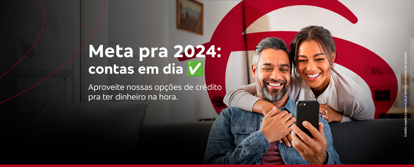 #PraCegoVer Texto: Temos um fundo vermelho com grafismos brancos e a imagem de um homem e uma mulher dançando na cozinha de casa. E em destaque temos o seguinte texto: 'Meta pra 2023: contas em dia. Conheça nossas opções de crédito pra ter dinheiro na hora.' Ao final temos um botão de 'Saiba mais'